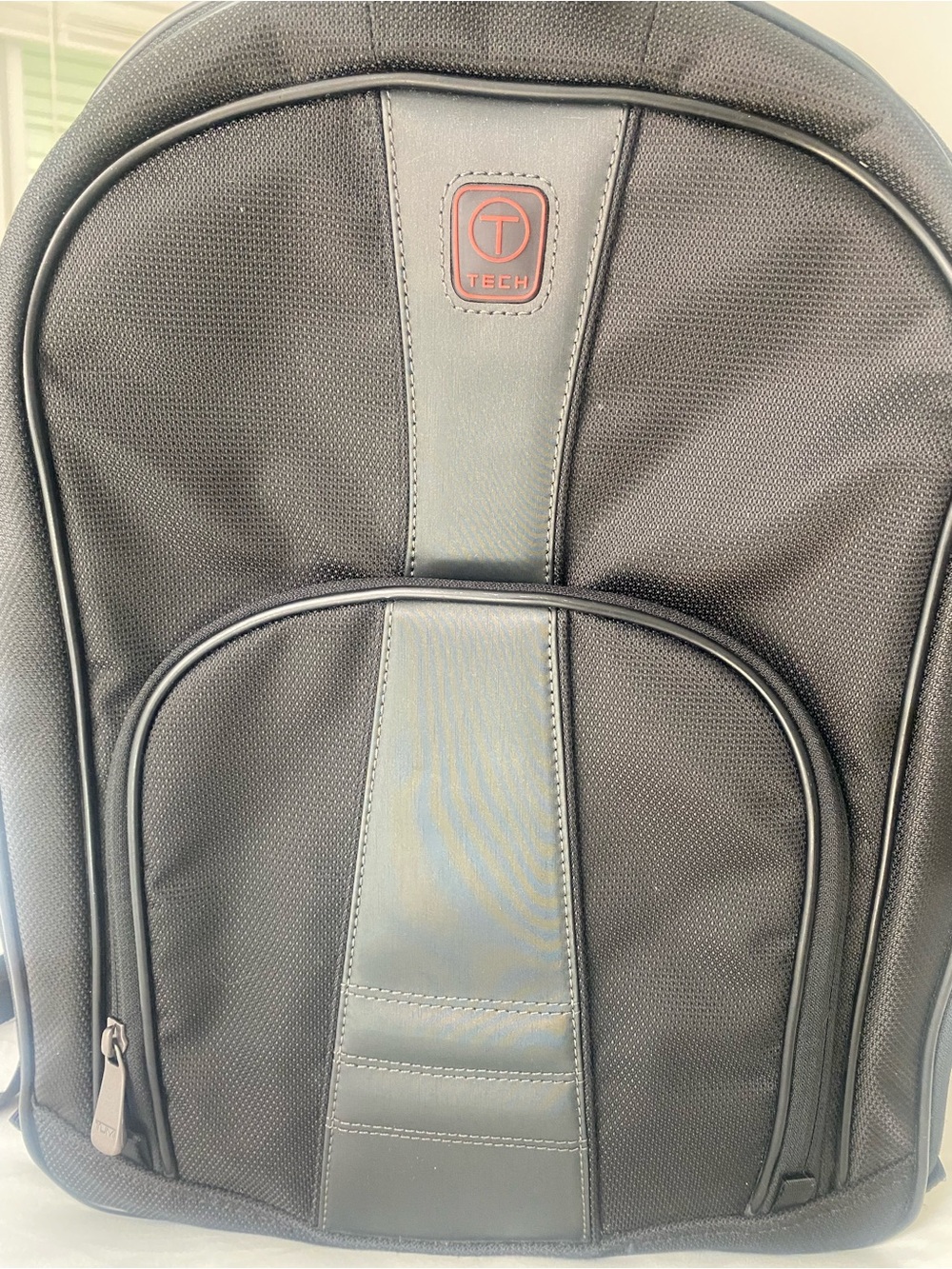 TUMI Black  Men's Minimalist Backpack  With  Travel Strap.